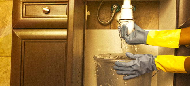 plumbing emergency taking place in kitchen