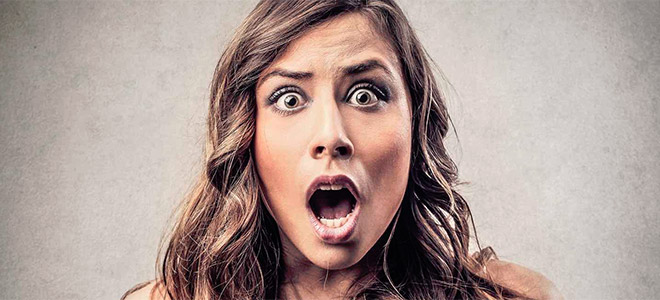 woman shocked about plumbing problem that needs her to call a 24-hour plumbing service