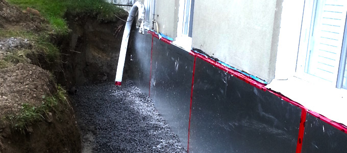 home in toronto receiving foundation waterproofing services showcasing a dug out foundation and waterproofing membrane