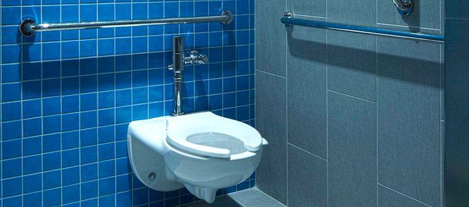 installed tankless toilet in an industrial bathroom